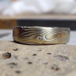 mokume gane wedding band 18k yellow gold with sterling silver wood grain pattern etched