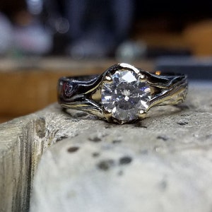 Handcrafted Artisan Mokume Gane engagement ring mokume roots blend to prongs