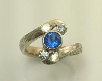 Three stone Mokume Gane engagment ring with Blue Sapphire and diamonds