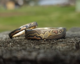 Unique matching band set of Mokume gane wedding band set from same billet tri gold and silver etched