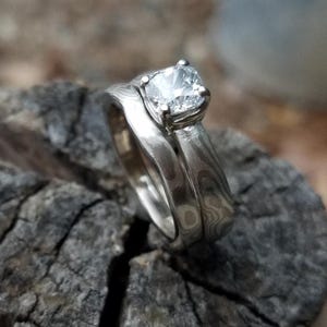 Mokume Gane Solitaire engagement ring with cushion cut moissanite and wedding band