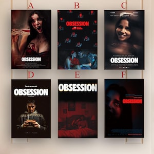May include: Six movie posters with the title "Obsession" are displayed. Each poster features different imagery, including portraits of people, couples, and scenes with red and dark tones. The posters are framed and mounted on a white wall.