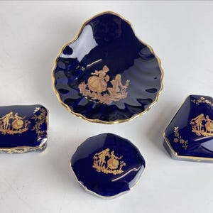 Set of four Vintage Limoges porcelain Castel Trinket dishes. Adorned with 22K gold accents. France Cobalt Blue Romantic Couple.