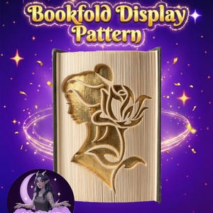 May include: A bookfold display pattern with a gold-colored silhouette of a woman's profile and a rose cut into the pages. The text "Bookfold Display Pattern" is in gold lettering. The background is purple with stars and confetti.
