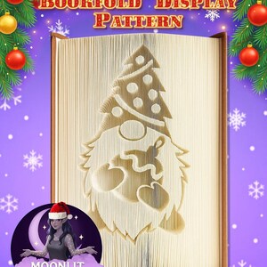 May include: A bookfold display pattern featuring a Christmas gnome design. The pages are folded to create the image of a gnome with a beard, a Christmas tree, and hearts. The background is purple with snowflakes and Christmas ornaments.