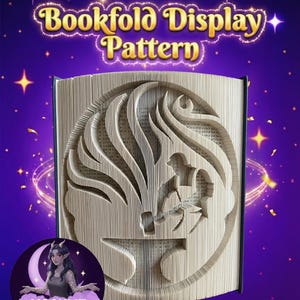 May include: A bookfold display pattern featuring a carved design of a person using a hammer. The book's pages are cut to form the image. The text "Bookfold Display Pattern" is displayed at the top of the image.