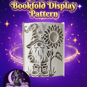 May include: A bookfold display pattern featuring a gnome holding a sunflower. The gnome has a long beard and a pointed hat. The text "Bookfold Display Pattern" is at the top of the image. The background is purple with gold stars.