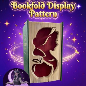 May include: A bookfold display pattern featuring a silhouette of a woman and an apple. The design is cut into the pages of a book, with a dark red interior. The book has a green spine and the text "Bookfold Display Pattern" is at the top.