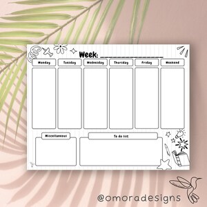 May include: A monochrome weekly planner featuring sections for each day, a to-do list, and miscellaneous notes. The planner includes decorative doodles and the text "Week:" and "To do list". The planner is set against a pale pink backdrop.