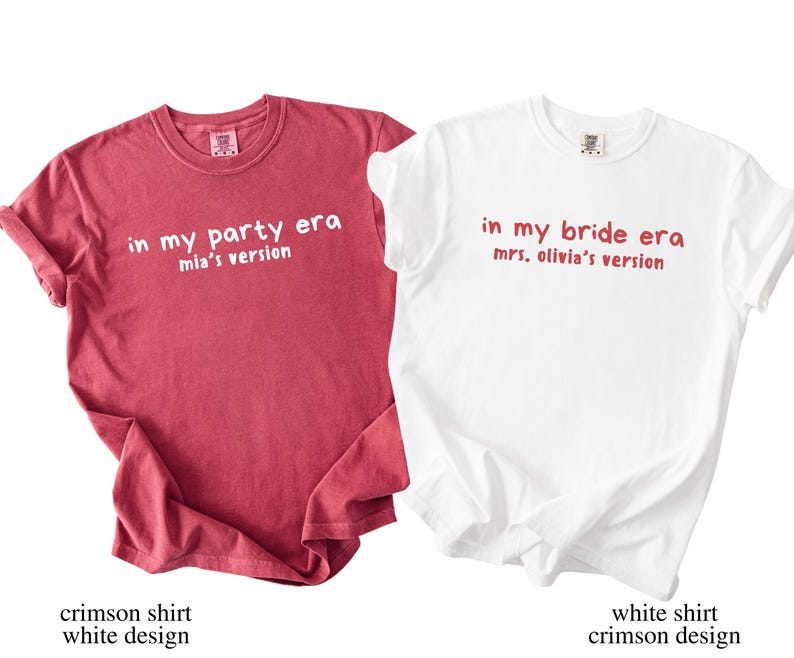May include: Two t-shirts, one crimson and one white, with text. The crimson shirt reads "in my party era, mia's version" in white. The white shirt says "in my bride era, mrs. olivia's version" in crimson. Both are short-sleeved.