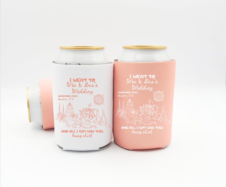 May include: White and coral-colored can coolers with gold rims. The coolers have the text "I WENT TO Wes & Ana's Wedding" and "AND ALL I GOT WAS THIS lousy shirt" printed on them, along with wedding-themed illustrations.