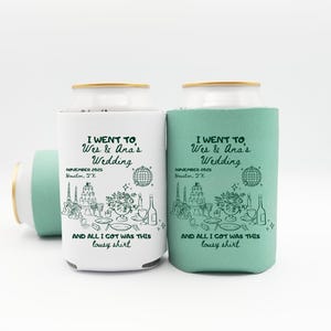 May include: White and teal can coolers with gold rims. The coolers have a wedding-themed design with text that reads "I went to Wes & Ana's Wedding, November 2025, Houston, TX, and all I got was this lousy shirt."