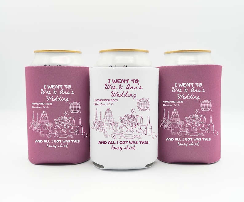 May include: Three can coolers with a wedding theme. Two are a deep magenta color, and one is white. Each cooler has the text "I went to Wes & Ana's Wedding" and "And all I got was this lousy shirt."