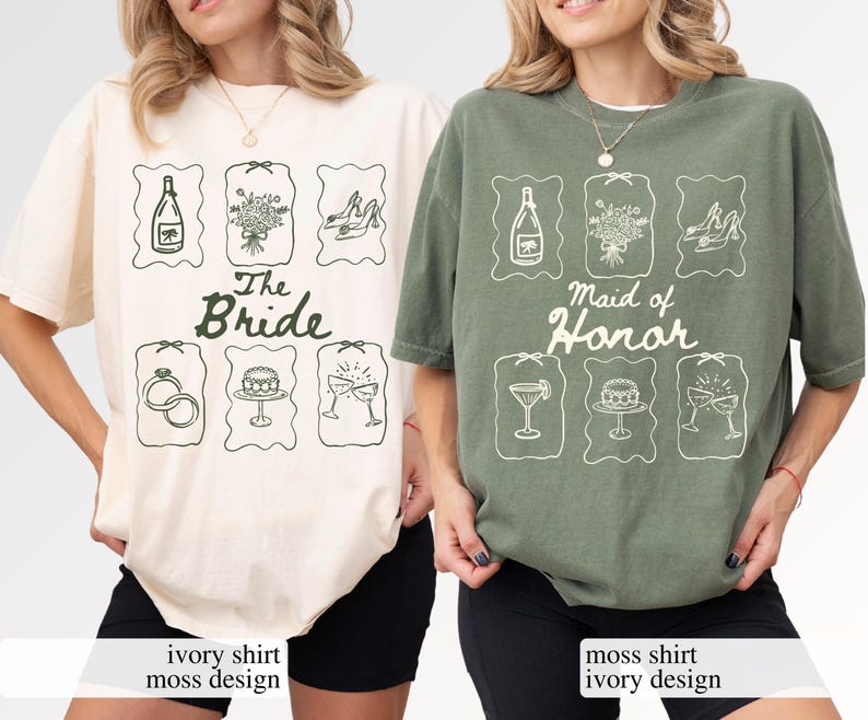 May include: Ivory and moss green t-shirts with matching graphic designs. The ivory shirt says "The Bride" and the moss green shirt says "Maid of Honour". Each shirt features illustrations of wedding-related items.