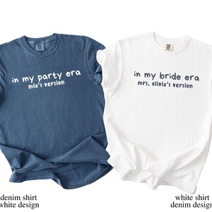 May include: Two t-shirts, one denim blue and one white, are displayed. The denim shirt has the text "in my party era mia's version" in white. The white shirt has the text "in my bride era mrs. olivia's version" in navy blue. The bottom of the image has the text "denim shirt white design" and "white shirt denim design".