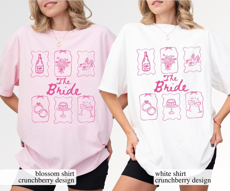 May include: Two oversized t-shirts, one pink and one white, each with a pink graphic. The design includes illustrations of a champagne bottle, bouquet, heels, rings, cake, and champagne glasses, with the text "The Bride".