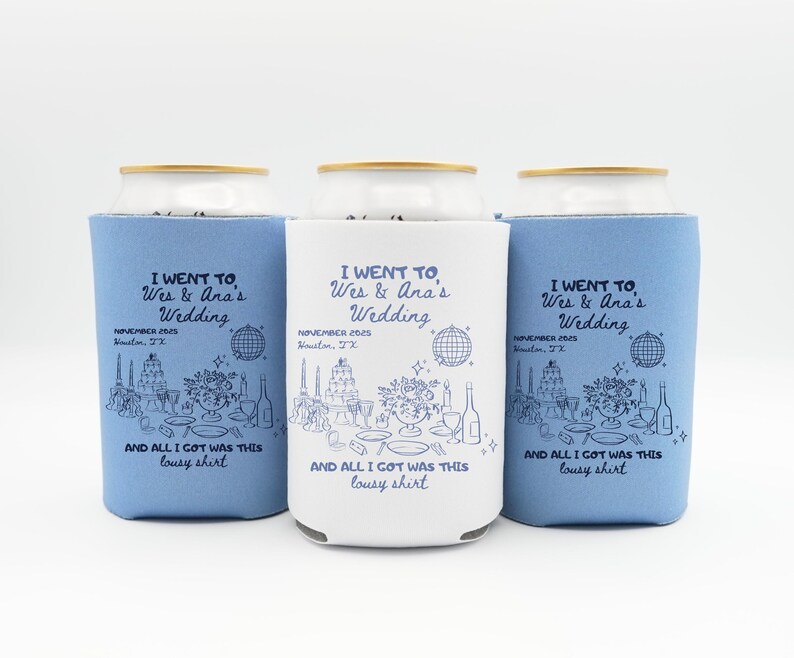 May include: Three can coolers, two in light blue and one in white, each with the text "I WENT TO Wes & Ana's Wedding" and event details. The design includes a line drawing of a wedding reception scene. The phrase "AND ALL I GOT WAS THIS lousy shirt" is also printed.