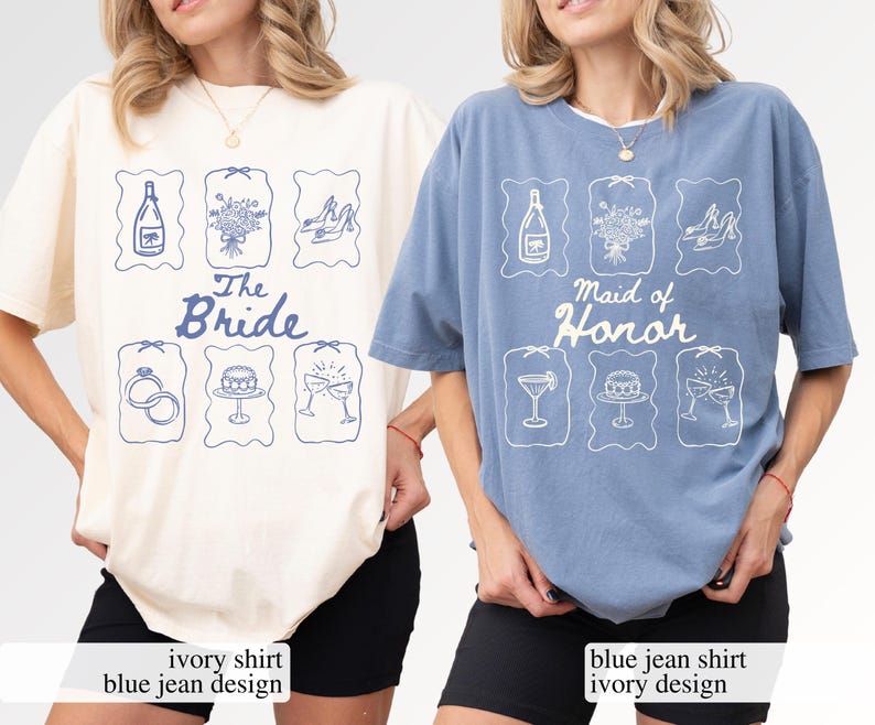 May include: Two t-shirts, one ivory and one blue jean, with matching designs. The ivory shirt says "The Bride" and the blue jean shirt says "Maid of Honor". Each shirt features blue illustrations of a bottle, flowers, and shoes.