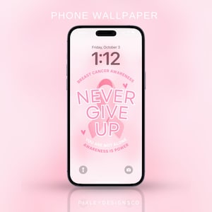 May include: A smartphone displays a pink wallpaper with the words "NEVER GIVE UP" and a pink ribbon, promoting breast cancer awareness. The phone's screen also shows the date and time.