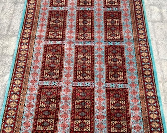 Hand knotted tribal wool rug 5x7ft – red & blue geometric design