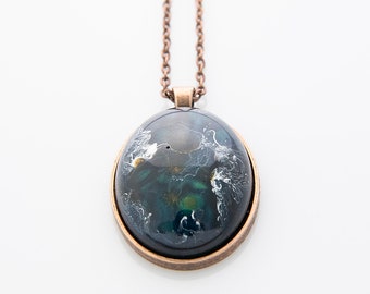 Planetary oval resin pendant necklace