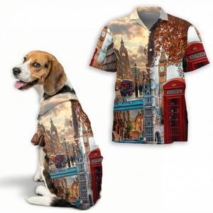 May include: A beagle dog with a short-sleeved shirt featuring a London-themed design. The shirt showcases iconic landmarks like Big Ben, red telephone booths, and Tower Bridge. The dog's fur is also patterned with the same London imagery.