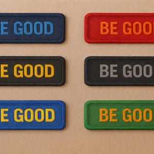 May include: Six rectangular patches in various colours, each with the words "BE GOOD" in a contrasting colour. Colours include blue, red, black, grey, green, and yellow. The patches have a textured appearance.