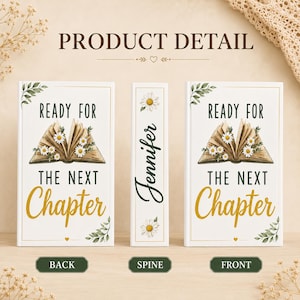 May include: A white book with a front, back, and spine view. The front and back covers feature an open book illustration with white daisies, green leaves, and the text "READY FOR THE NEXT Chapter". The spine displays the name "Jennifer" and a daisy.