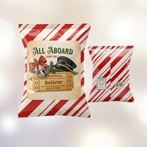 May include: Two candy cane striped bags. One bag has a vintage style label with the words "All Aboard" and "Believe". The label also features a bell, conductor hat, and holly. The other bag is candy cane striped.
