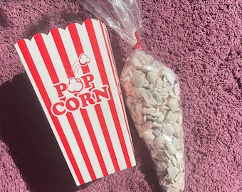 Bag of seashells with popcorn storage box bundled together