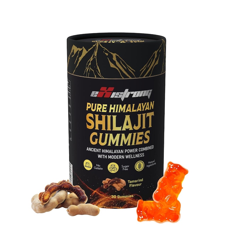 May include: A black cylindrical container with gold lettering and a mountain graphic, labelled "eXstrong PURE HIMALAYAN SHILAJIT GUMMIES." The image includes tamarind fruit and orange gummy bear shapes. The container states "No Gelatin" and "Sugar Free."
