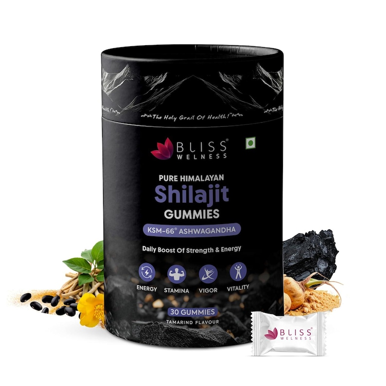 May include: A black cylindrical container of Bliss Wellness Pure Himalayan Shilajit Gummies. The label includes text about the product's benefits, such as energy and stamina, and the flavor is tamarind. A small packet of gummies is also visible.