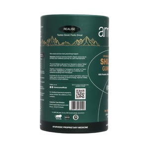 May include: A cylindrical, dark green container with the text "REALISE Tastes Good, Feels Great" and "ORIGINAL SHILAJIT GUM" in white. The label includes information about the product and its Ayurvedic origins, along with a QR code and the brand name "am".