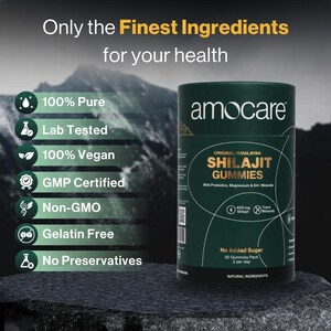 May include: A dark green cylindrical container of Amocare Shilajit Gummies. The label highlights "Original Himalayan Shilajit Gummies" with prebiotics, magnesium, and minerals. Text on the label also states "No Added Sugar" and "Natural Ingredients". The background features a mountain range.