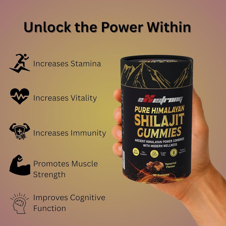 May include: A black cylindrical container of Shilajit Gummies is held in a hand. The label reads "Pure Himalayan Shilajit Gummies" with the flavour "Tamarind". The text "Unlock the Power Within" is at the top, with icons and text describing benefits.