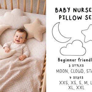 May include: A baby smiles in a cot, surrounded by beige pillows shaped like a moon, cloud, and star. The cot has a wooden frame and a patterned blanket. Text on the right reads "BABY NURSERY PILLOW SET" with size options.