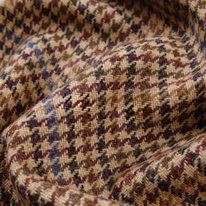 May include: A rustic wooden sign with the text "Welcome to our home" in white lettering. The sign features a distressed finish and a simple, inviting design, perfect for front door decor.