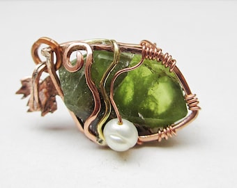 Raw peridot crystal pendant copper wire wrapped