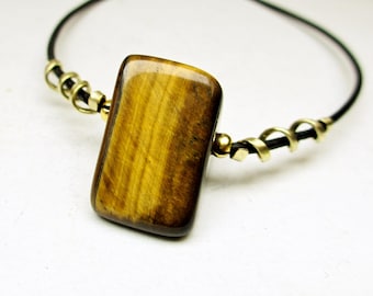 Huge tiger's eye triangle pendant in brass, black leather cord, custom length, unisex necklace