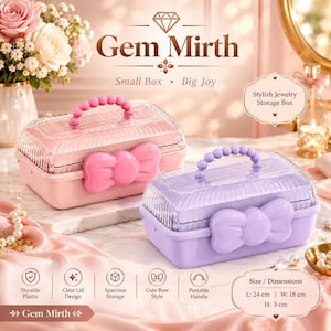 May include: Two rectangular jewellery storage boxes, one pink and one purple, featuring clear ribbed lids, a beaded handle, and a large bow clasp. Text includes Gem Mirth, Small Box Big Joy, and dimensions of L: 24 cm, W: 18 cm, H: 3 cm.