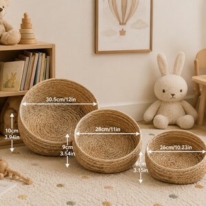 May include: Three woven, round baskets of varying sizes. The largest is 12 inches in diameter, the medium is 11 inches, and the smallest is 10.23 inches. The baskets are made of natural-colored woven material and are suitable for storage or decoration.