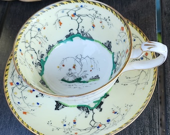 Hand Painted Vellum China by Paragon England Courting Couple Yellow Black Cup & Saucer