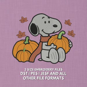 May include: An embroidered design featuring a cartoon character with gray fur, wearing a rust-colored scarf, and holding two orange pumpkins. Brown leaves are scattered around the character. The text at the bottom reads "3 SIZE EMBROIDERY FILES DST | PES | JESF AND ALL OTHER FILE FORMATS."