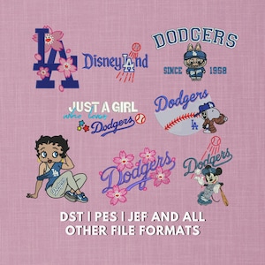 May include: A pink fabric with various embroidered designs featuring the Los Angeles Dodgers logo, Disney, and cartoon characters. Text includes "Dodgers," "Disneyland," and "Just a Girl who loves Dodgers."