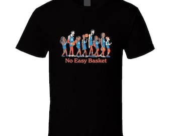 May include: Black t-shirt featuring a cartoon illustration of basketball players in blue and orange uniforms. The text "No Easy Basket" is printed in red below the players. The shirt is made of a soft, comfortable material.