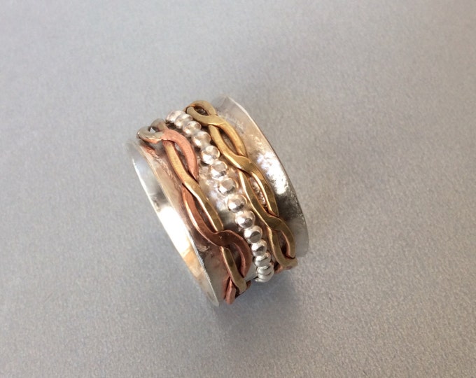 Sterling silver spinner ring withThree sweet spinners