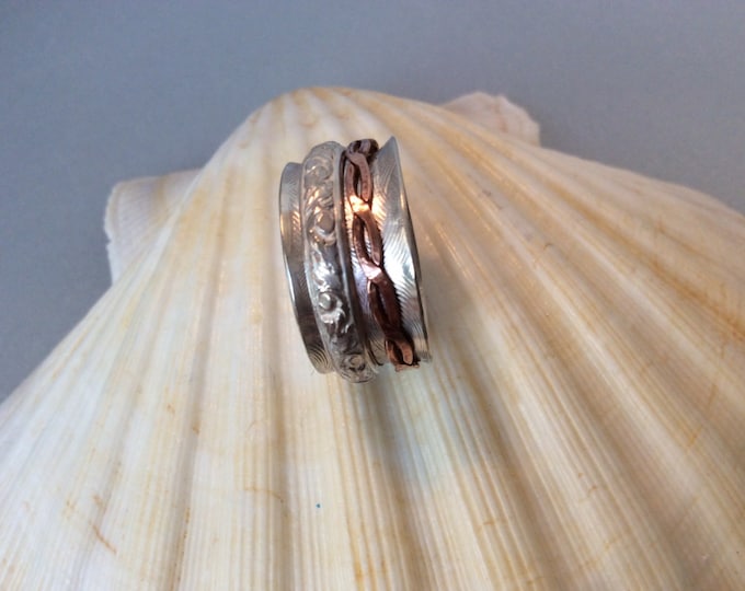 Sterling silver spinner ring with copper and silver band