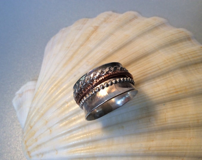 Sterling silver spinner ring with copper and silver band