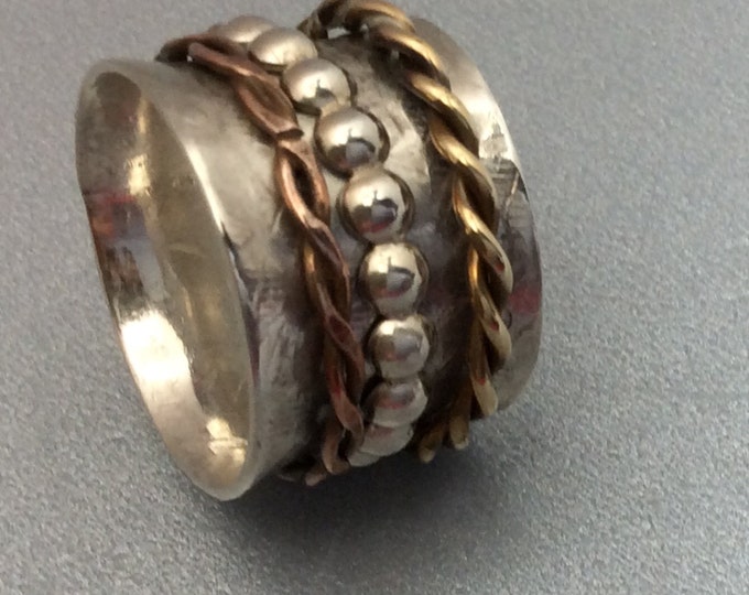 Sterling silver spinner ring with brass and copper spinners