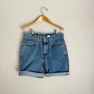 vintage 90s Levi's 550 jean cutoffs cutoff shorts 30 waist image 1